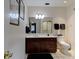 Clean bathroom with dark wood vanity and a toilet at 6779 Clayton St, Mount Dora, FL 32757