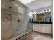 Elegant bathroom with a large walk-in shower and double vanity at 6779 Clayton St, Mount Dora, FL 32757