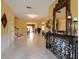 Bright foyer with tiled floors and ornate mirror at 6779 Clayton St, Mount Dora, FL 32757