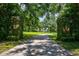 Grand entrance to estate with lush landscaping at 6779 Clayton St, Mount Dora, FL 32757