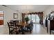 Formal dining room with large table and access to patio at 6779 Clayton St, Mount Dora, FL 32757