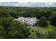 Elegant home with circular driveway and lush green surroundings at 6779 Clayton St, Mount Dora, FL 32757