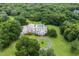 Luxury home with circular driveway and a refreshing blue pool at 6779 Clayton St, Mount Dora, FL 32757
