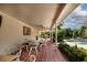 Covered patio with dining furniture and pool view at 6779 Clayton St, Mount Dora, FL 32757