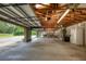 Large garage with ample storage space and high ceilings at 6779 Clayton St, Mount Dora, FL 32757