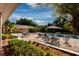 Spacious pool area with patio furniture and lush landscaping at 6779 Clayton St, Mount Dora, FL 32757