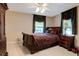 Comfortable bedroom with a sleigh bed and dark wood furniture at 6779 Clayton St, Mount Dora, FL 32757