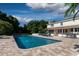 Inviting pool area with ample lounge space and water features at 6779 Clayton St, Mount Dora, FL 32757