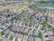 Aerial view of the community with golf course and homes at 2410 Little Mountain Loop, The Villages, FL 32162