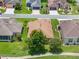 Aerial view showcasing home's roofline and landscaping at 4835 Kelso St, Leesburg, FL 34748