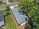 Aerial view of a single-Gathering home with a gray roof and concrete driveway at 500 E Lakeview Ave, Eustis, FL 32726