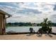 Relaxing lake view from patio with comfortable seating at 2537 E Crooked Lake Dr, Eustis, FL 32726