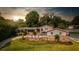 Two-story house with stone accents and landscaping at 2537 E Crooked Lake Dr, Eustis, FL 32726