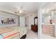 Bedroom with ensuite bathroom and coastal decor at 2537 E Crooked Lake Dr, Eustis, FL 32726