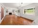 Spacious living room with hardwood floors and a fireplace at 2537 E Crooked Lake Dr, Eustis, FL 32726