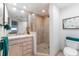 Bathroom with glass shower, updated vanity, and tile flooring at 2537 E Crooked Lake Dr, Eustis, FL 32726
