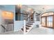 Elegant staircase with wrought iron railing and hardwood steps at 2537 E Crooked Lake Dr, Eustis, FL 32726