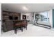 Finished game room with lake views, TV, and exercise equipment at 2537 E Crooked Lake Dr, Eustis, FL 32726