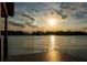 Scenic sunset view over lake from dock at 2537 E Crooked Lake Dr, Eustis, FL 32726