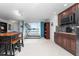 Kitchen with dark wood cabinets and lake view at 2537 E Crooked Lake Dr, Eustis, FL 32726