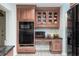 Kitchen offers built-in desk and ample storage at 2537 E Crooked Lake Dr, Eustis, FL 32726