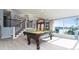 Game room with pool table and lake view at 2537 E Crooked Lake Dr, Eustis, FL 32726