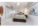 Bright bedroom with coastal decor and comfortable bedding at 2537 E Crooked Lake Dr, Eustis, FL 32726