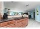Kitchen boasts granite counters and wood cabinetry at 2537 E Crooked Lake Dr, Eustis, FL 32726