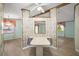 Kitchen with breakfast bar and floral wallpaper at 25043 Bellevue, Leesburg, FL 34748