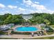 Resort-style pool with surrounding lounge chairs and landscaping at 25043 Bellevue, Leesburg, FL 34748