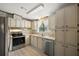 Kitchen with stainless steel appliances and light cabinets at 25043 Bellevue, Leesburg, FL 34748