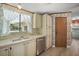 Kitchen features stainless steel appliances and double sink at 25043 Bellevue, Leesburg, FL 34748