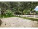 Landscaped backyard with white fence and lush greenery at 25043 Bellevue, Leesburg, FL 34748