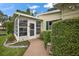 Enclosed patio with access to backyard and landscaping at 25043 Bellevue, Leesburg, FL 34748