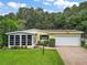 Single story home with attached garage, and well-maintained lawn at 25043 Bellevue, Leesburg, FL 34748