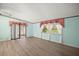 Living room with sliding glass doors leading to a patio at 25043 Bellevue, Leesburg, FL 34748