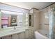 Bathroom with bathtub, shower, and updated vanity at 25043 Bellevue, Leesburg, FL 34748