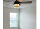 Bright bedroom with ceiling fan and window coverings at 6904 Church Lake St, Groveland, FL 34736