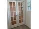 White double doors with glass panes leading to another room at 6904 Church Lake St, Groveland, FL 34736