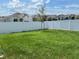 Fenced backyard with grassy area at 6904 Church Lake St, Groveland, FL 34736