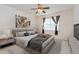 Spacious bedroom with a ceiling fan and large window at 123 Carrick Bend Way, Clermont, FL 34711