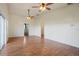 Spacious main bedroom with wood flooring and access to bathroom at 13832 Bay Lake Rd, Groveland, FL 34736