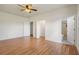 Bright bedroom with hardwood floors and access to bathroom at 13832 Bay Lake Rd, Groveland, FL 34736