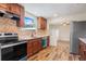 Updated kitchen featuring stainless steel appliances and wood cabinets at 13832 Bay Lake Rd, Groveland, FL 34736