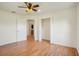 Bright bedroom with wood floors and ceiling fan at 13832 Bay Lake Rd, Groveland, FL 34736