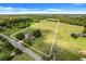 Aerial view showing house and large lot with pond in background at 13832 Bay Lake Rd, Groveland, FL 34736