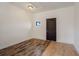 Bonus room with wood-look tile and dark door at 13832 Bay Lake Rd, Groveland, FL 34736