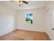 Bedroom with hardwood floors and a window overlooking the countryside at 13832 Bay Lake Rd, Groveland, FL 34736