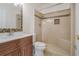 Bathroom with a walk-in shower and modern wood vanity at 13832 Bay Lake Rd, Groveland, FL 34736