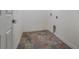 Laundry room with tiled floor and built-in shelving at 13832 Bay Lake Rd, Groveland, FL 34736